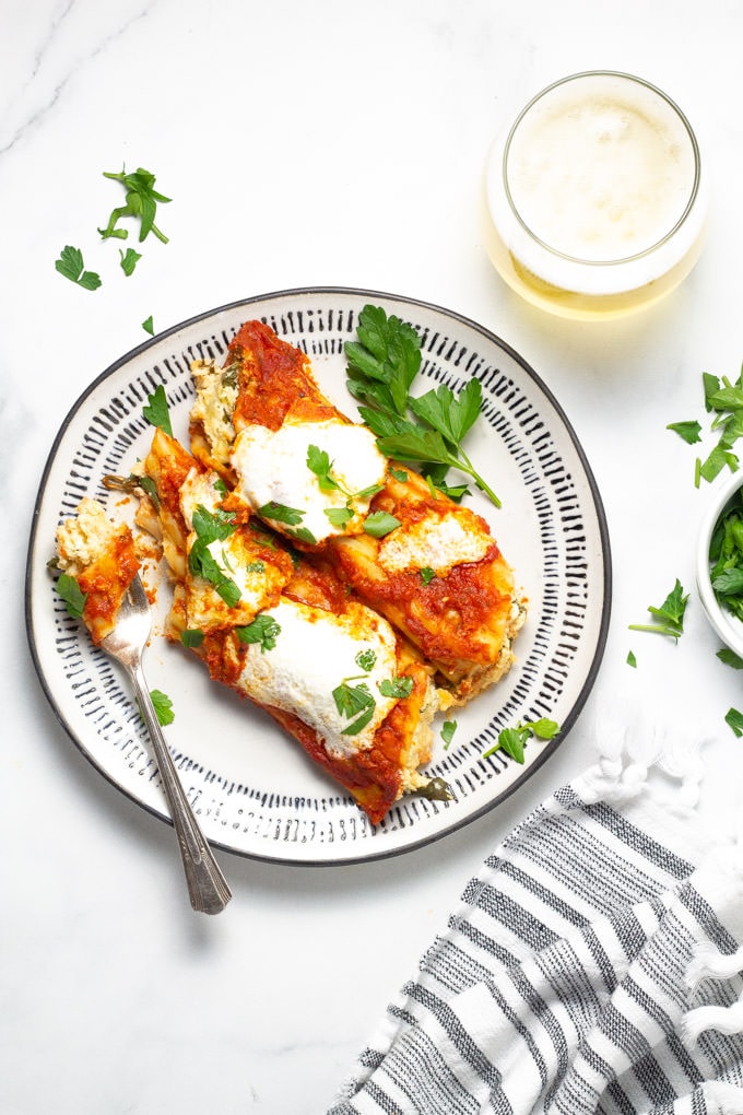 Plate of manicotti with a bite taken out of it