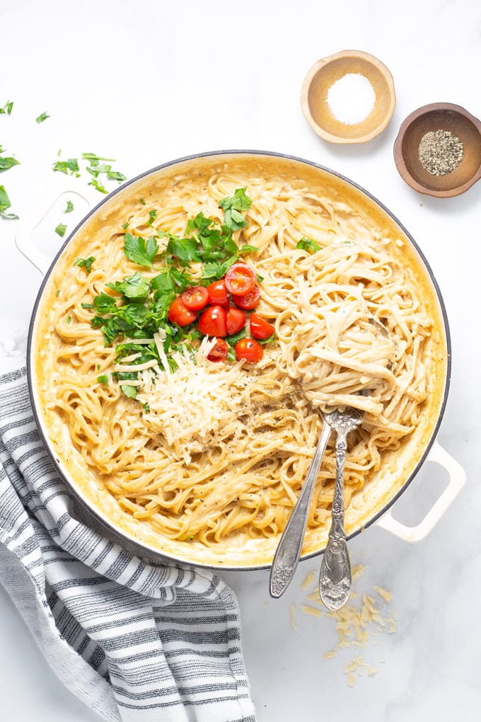 A large pot filled with fettuccine alfredo