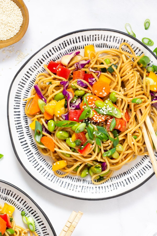 Close up shot of Asian noodle salad garnished with sesame seeds
