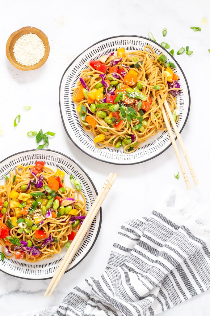 Two plates of vegan sesame ginger pasta salad