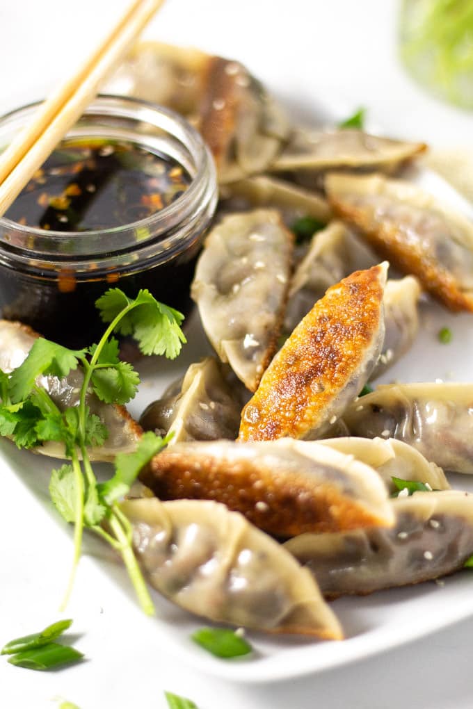 Close up shot of vegan dumplings with soy sauce