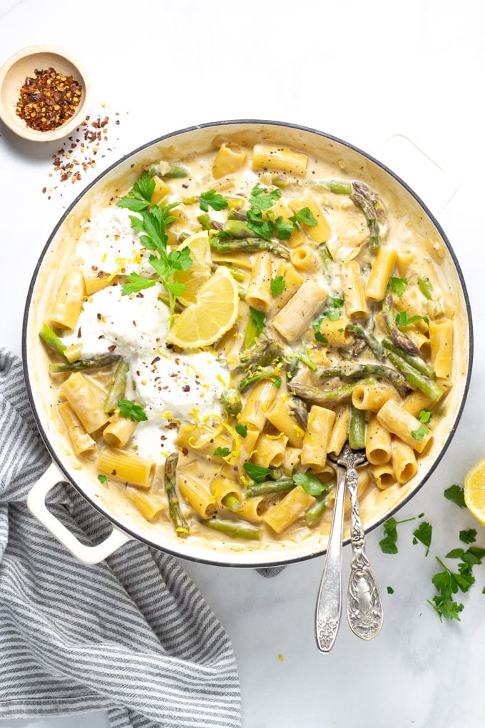 Overhead shot of a large pot filled with lemon garlic rigatoni and garnished with parsley