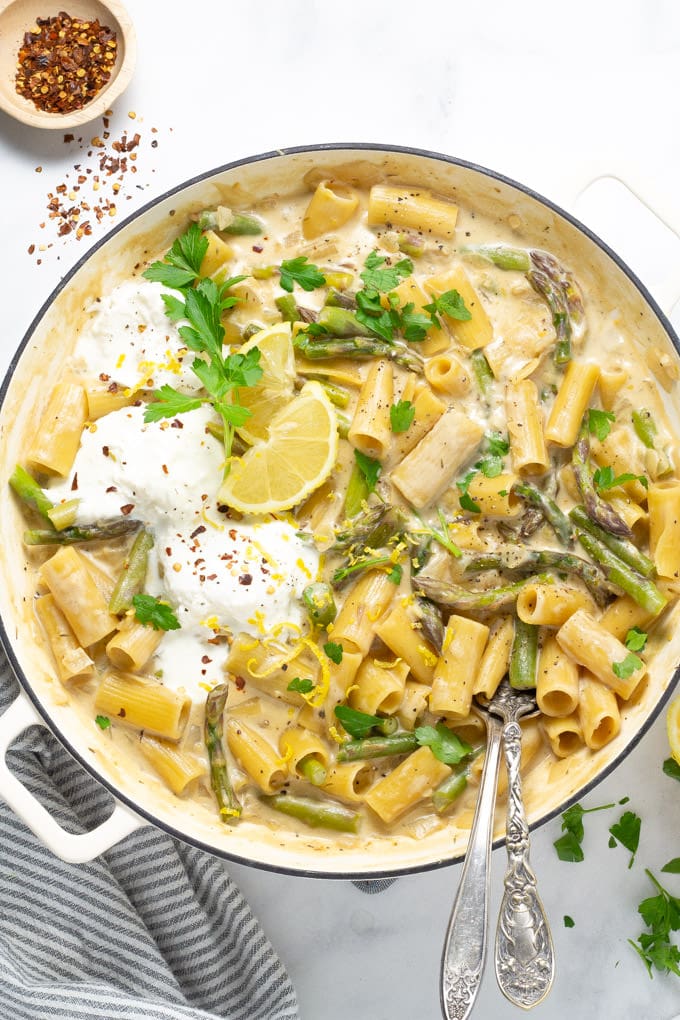 Overhead shot of a large pot filled with lemon garlic rigatoni and garnished with parsley