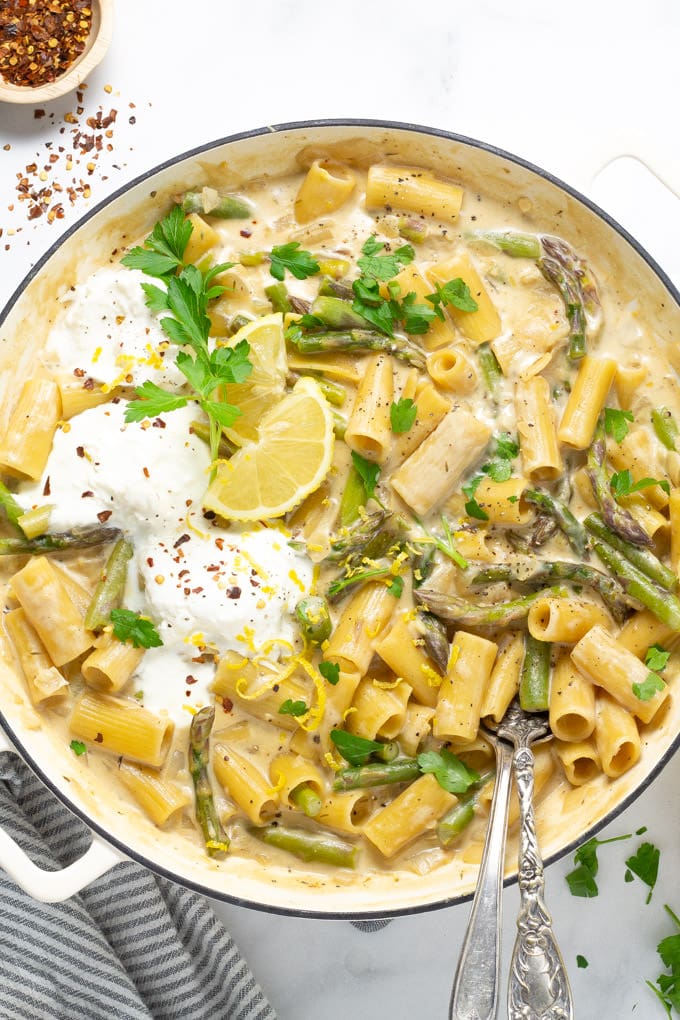 Overhead shot of a large pot filled with lemon garlic rigatoni and garnished with parsley