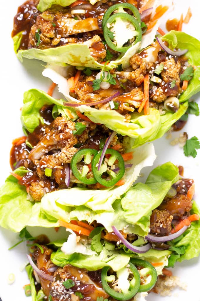 Overhead shot of Korean Cauliflower Lettuce Wraps on a white serving platter