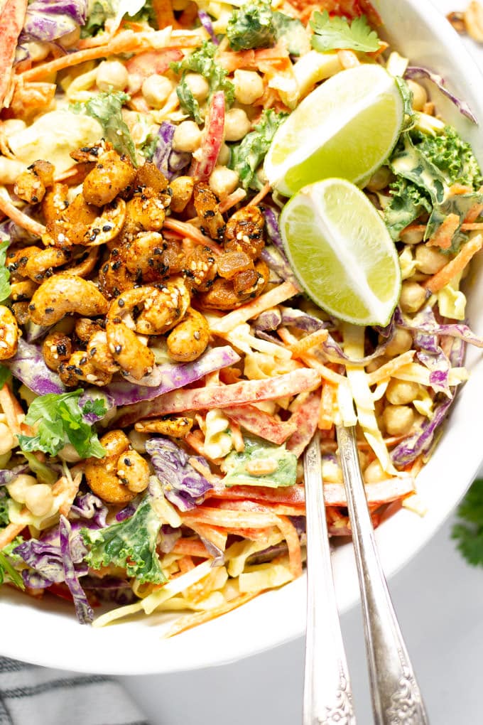 Overhead shot of curry slaw garnished with fresh cilantro and lime