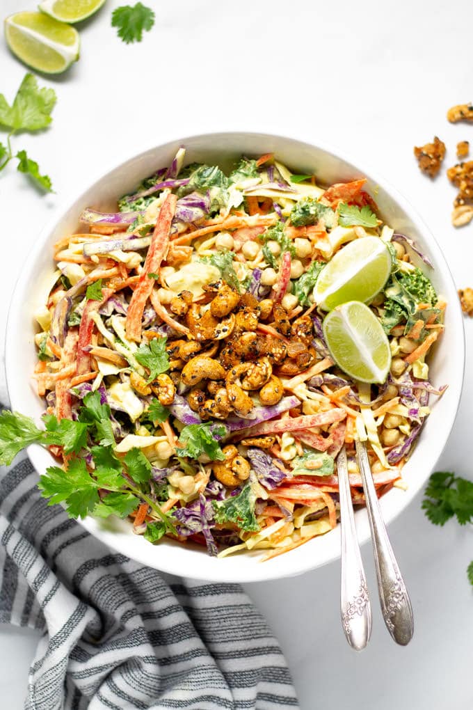 Overhead shot of curry slaw garnished with fresh cilantro and lime