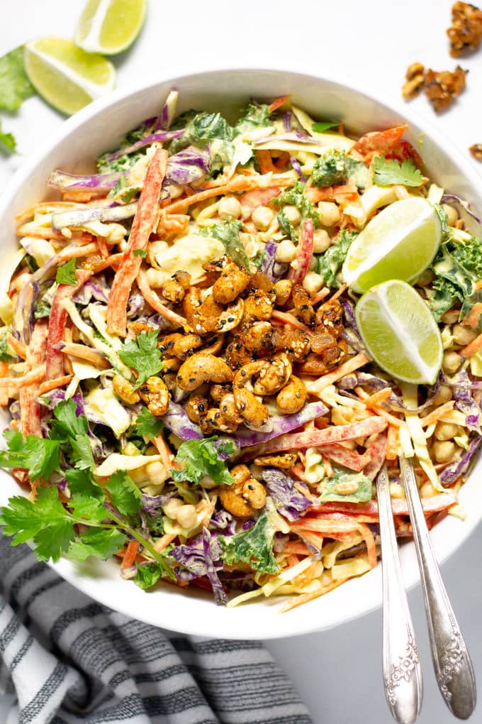 Overhead shot of curry slaw garnished with fresh cilantro and lime