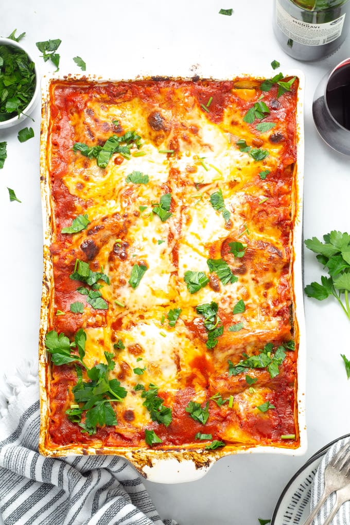 Overhead shot of a white baking dish filled with homemade lasagna