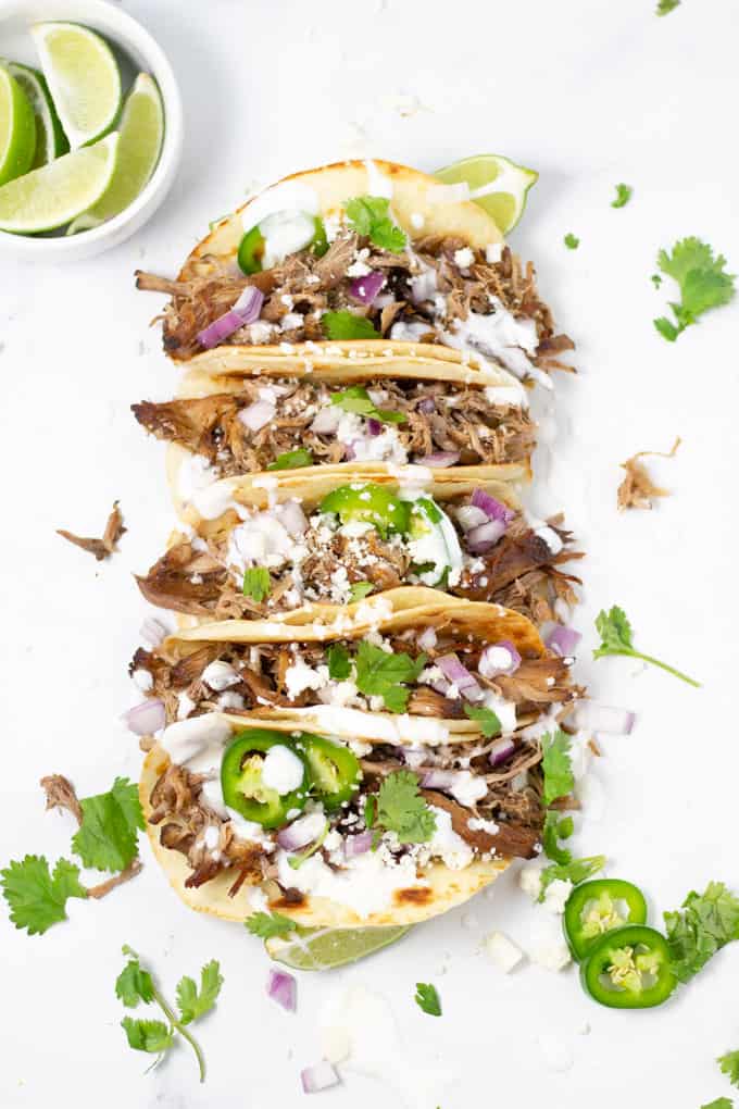 Overhead shot of 5 beer braised pork carnitas tacos