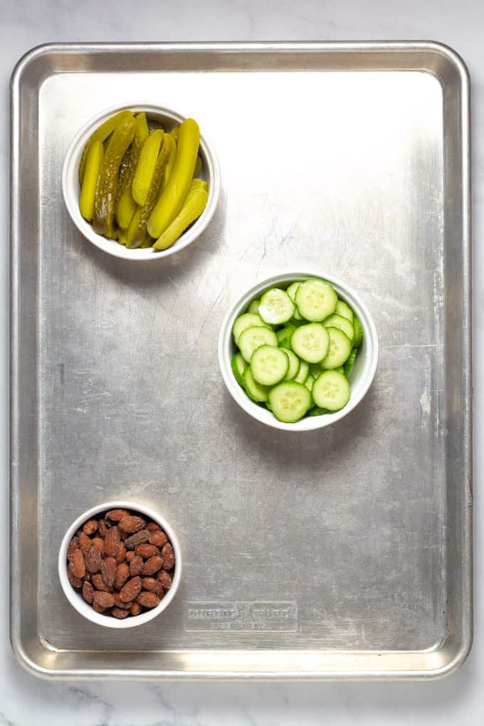 Overhead shot of a baking sheet filled with meat and cheese creating a cheese board