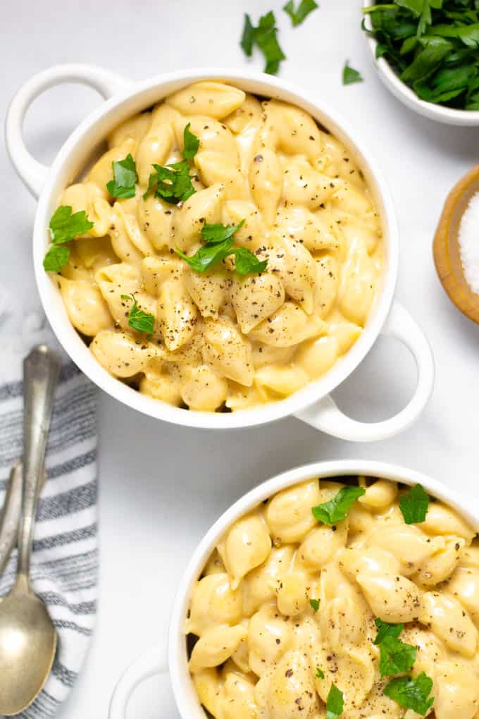 Two white bowls filled with one pot macaroni and cheese