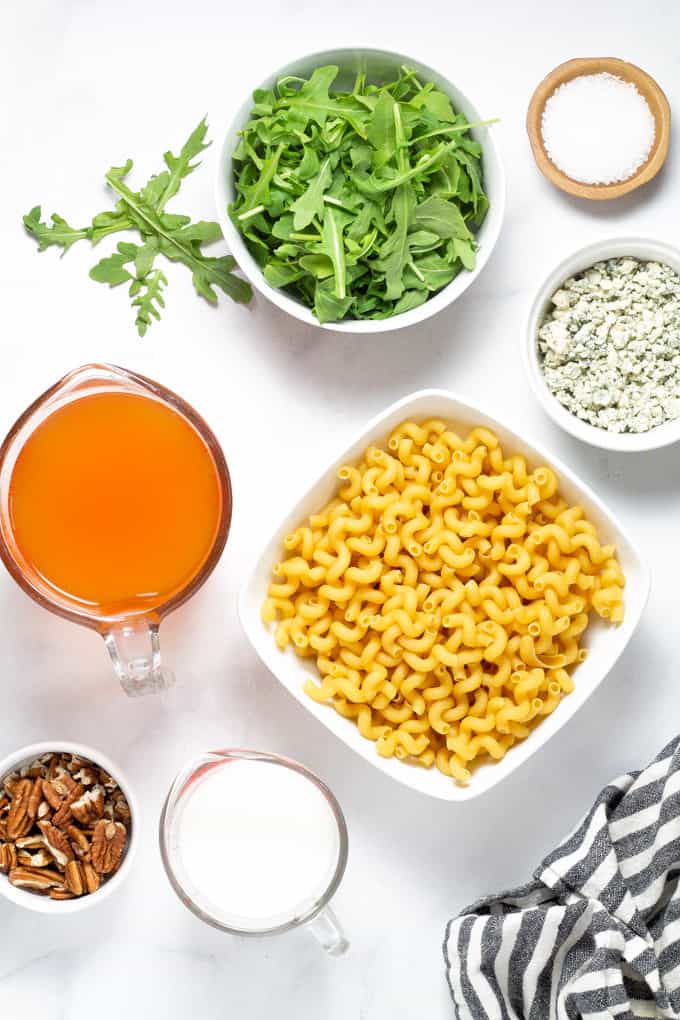 White marble counter top filled with ingredients to make Gorgonzola pasta
