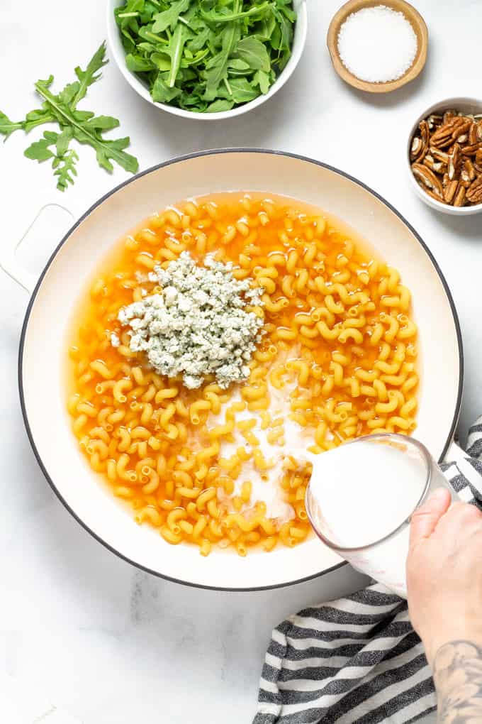 Overhead shot of a large pan filled with ingredients to make Gorgonzola pasta