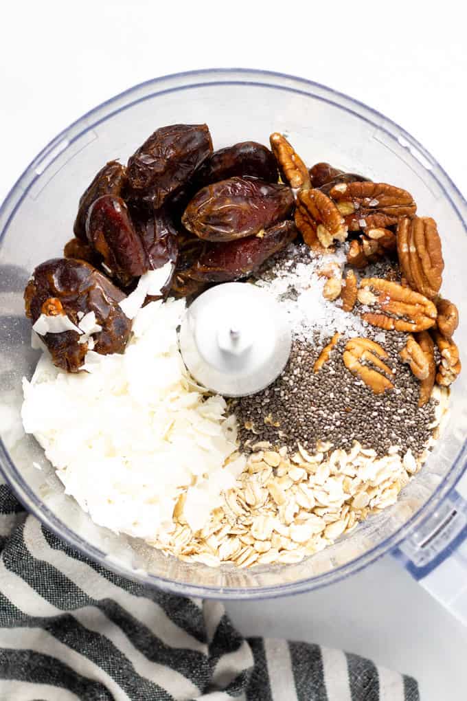 Close up shot of a food processor filled with ingredients to make fresh homemade rawnola