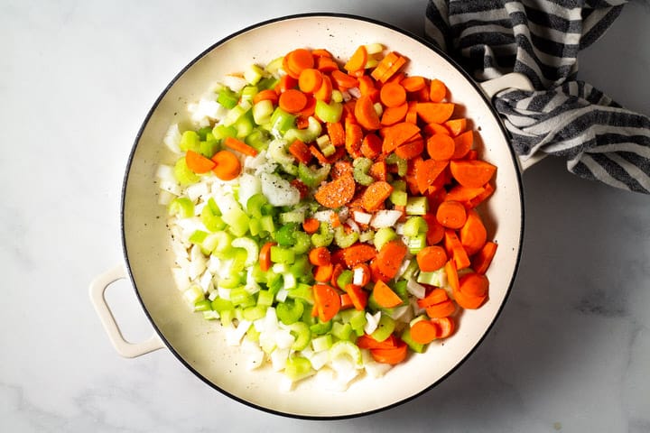 Large pot filled with carrots celery and onion