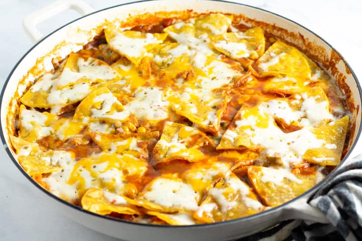 White saute pan filled with vegetarian one pan enchiladas