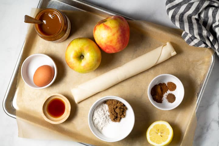 Baking sheet filled with ingredients to make an easy apple tart