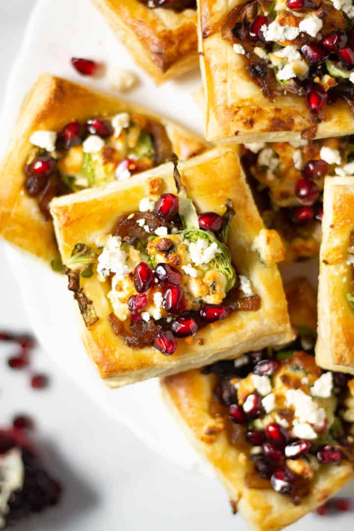 Overhead shot of a white platter of filled with brussels sprout tarts
