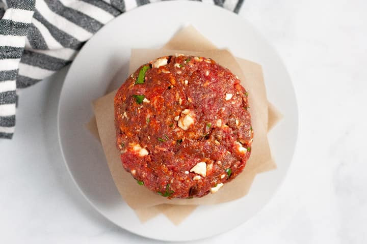 Overhead shot of a white plate filled with Mexican burger patties