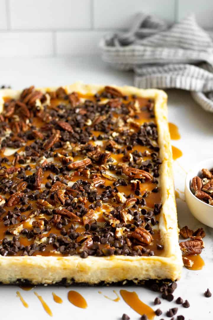 Close up shot of a rectangle of turtle cheesecake