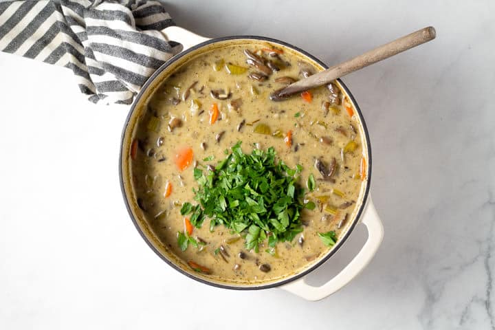 Large dutch oven filled with wild rice soup