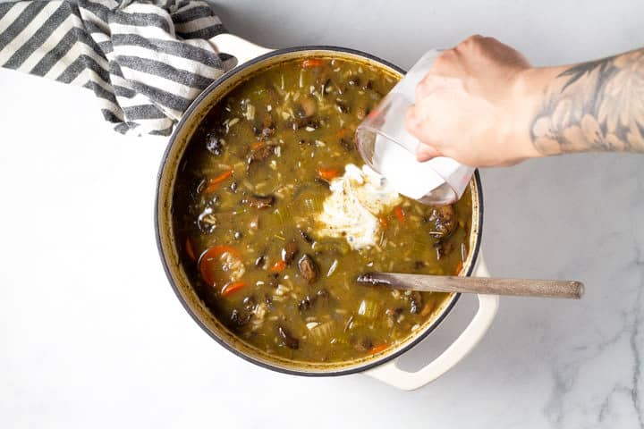 Large dutch oven filled with wild rice soup