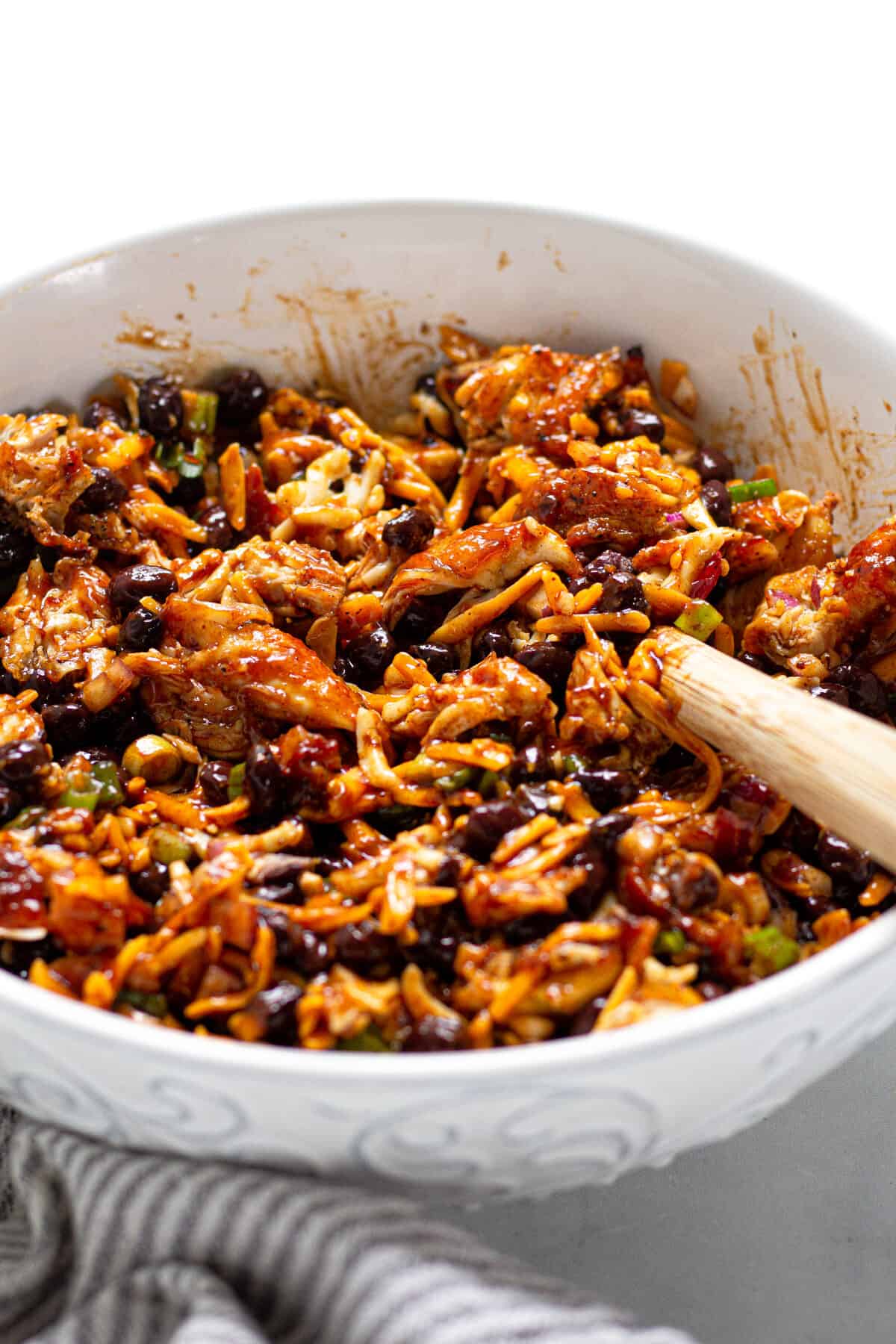 Large white bowl filled with ingredients for barbecue chicken quesadillas
