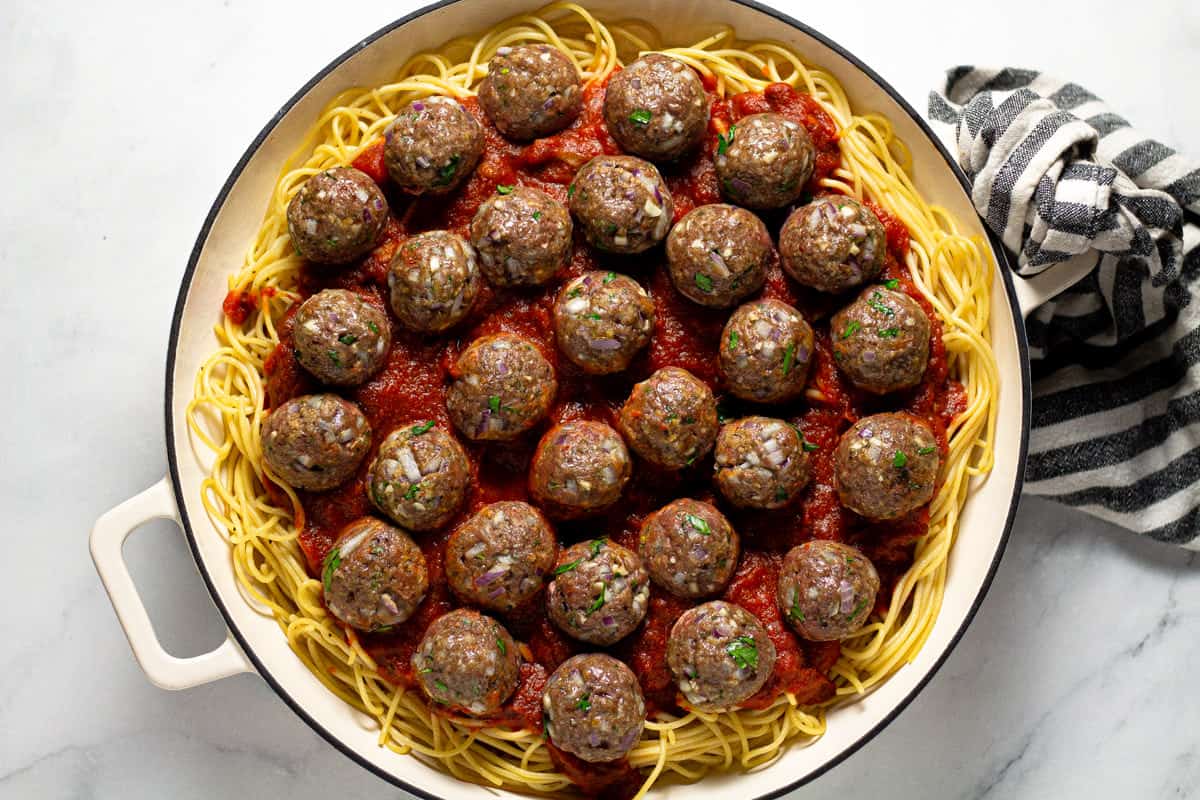 Large white pan filled with baked spaghetti casserole