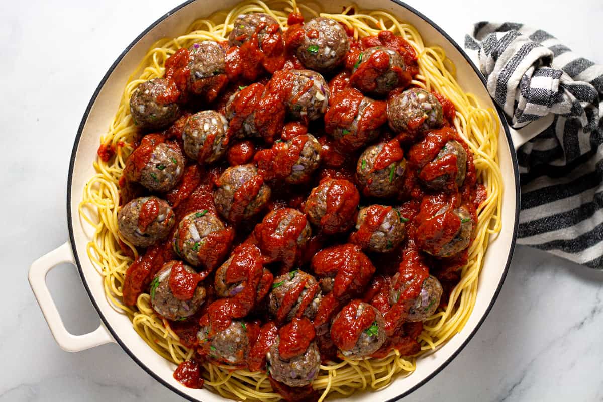 Large white pan filled with baked spaghetti casserole