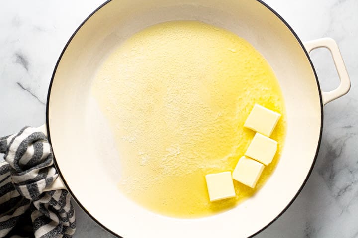 Large white pot with butter melting in it 