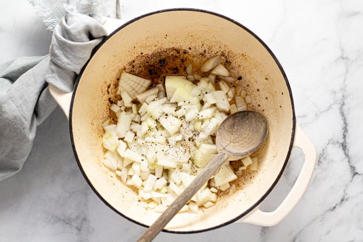 Large pot with onions being sauteed