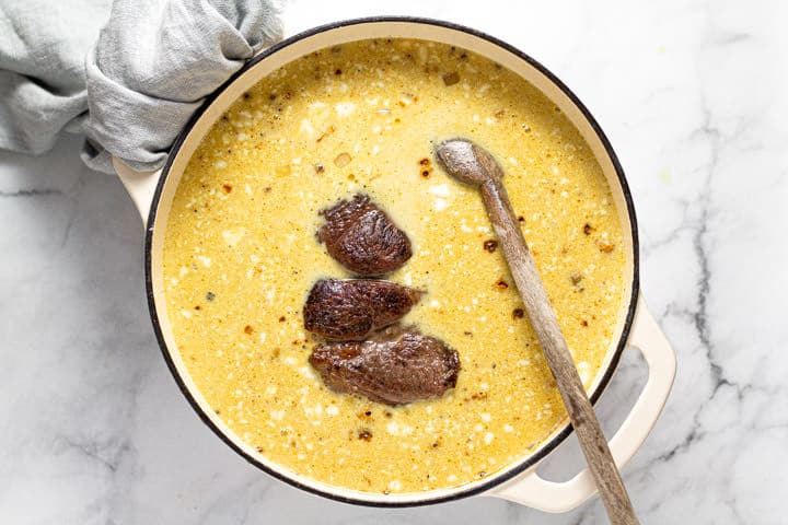Large pot filled with curried beef