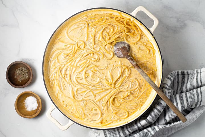 Large white pot filled with one pot alfredo being cooked