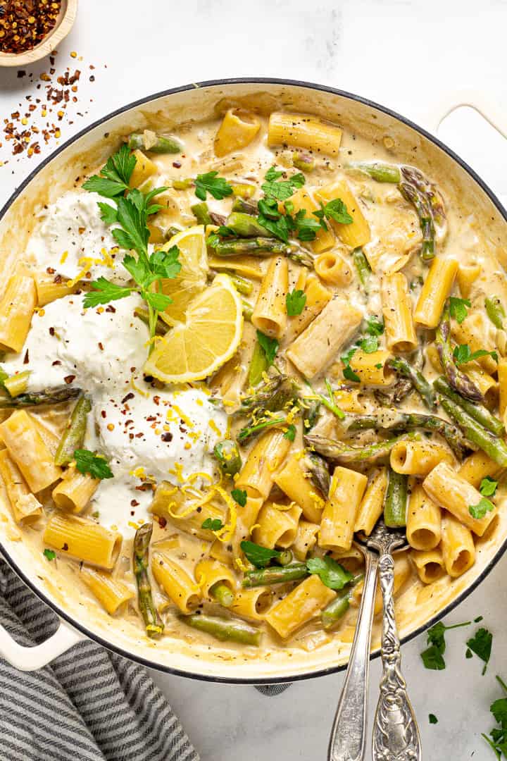 Overhead shot of a large pot filled with lemon garlic rigatoni and garnished with parsley