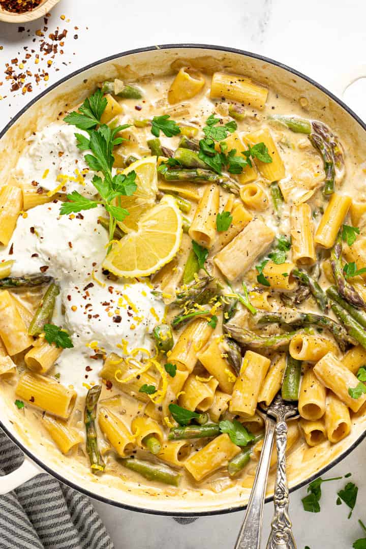 Overhead shot of a large pot filled with lemon garlic pasta and garnished with parsley