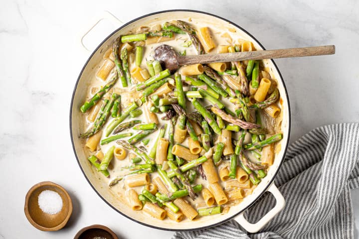 Overhead shot of a white pot filled with one pot rigatoni