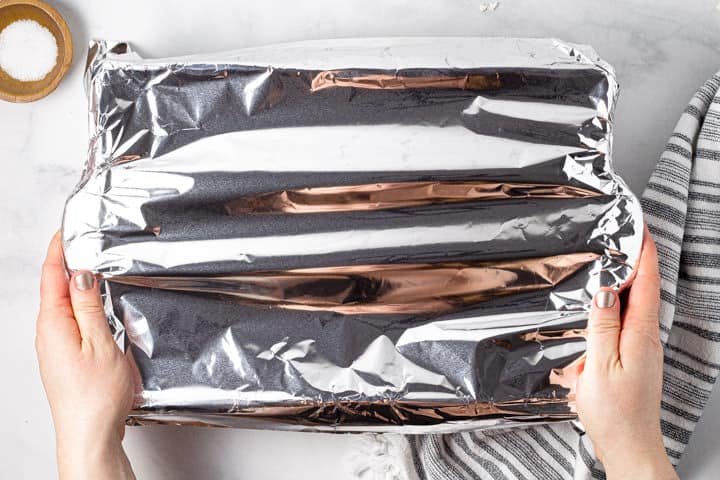 A 9x13 pan of manicotti covered with tin foil