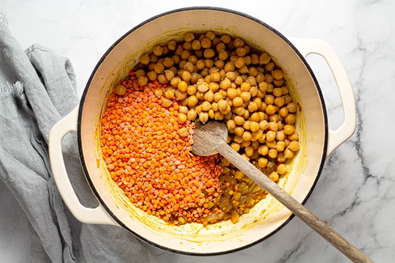 Large white pot filled with chickpeas and split red lentils 