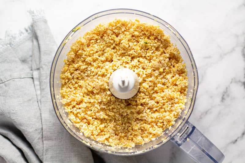Food processor filled with minced chickpeas 