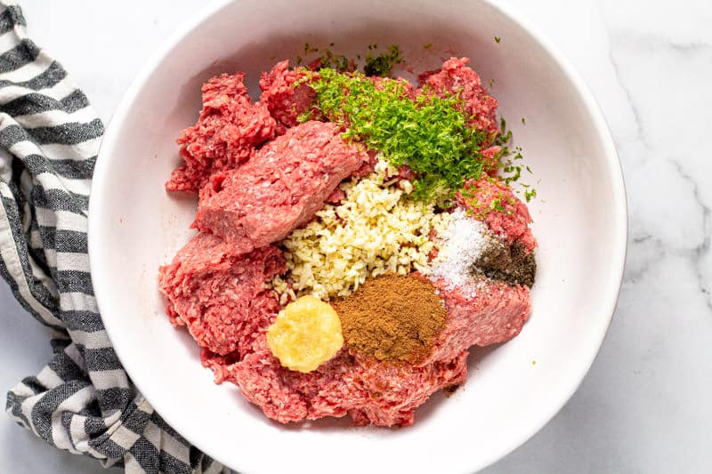 Large white bowl with ingredients to make Banh Mi burgers patties