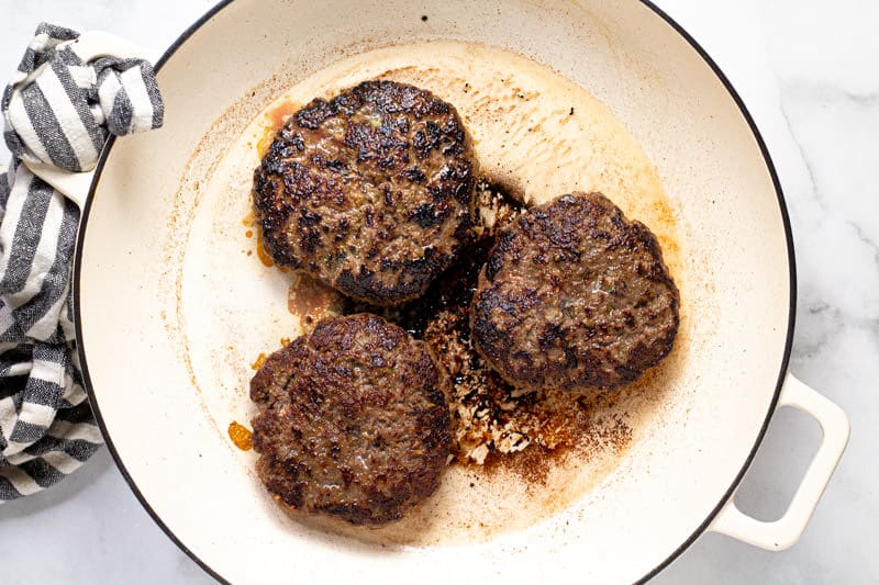Large white pan with cooked Banh Mi burgers in it
