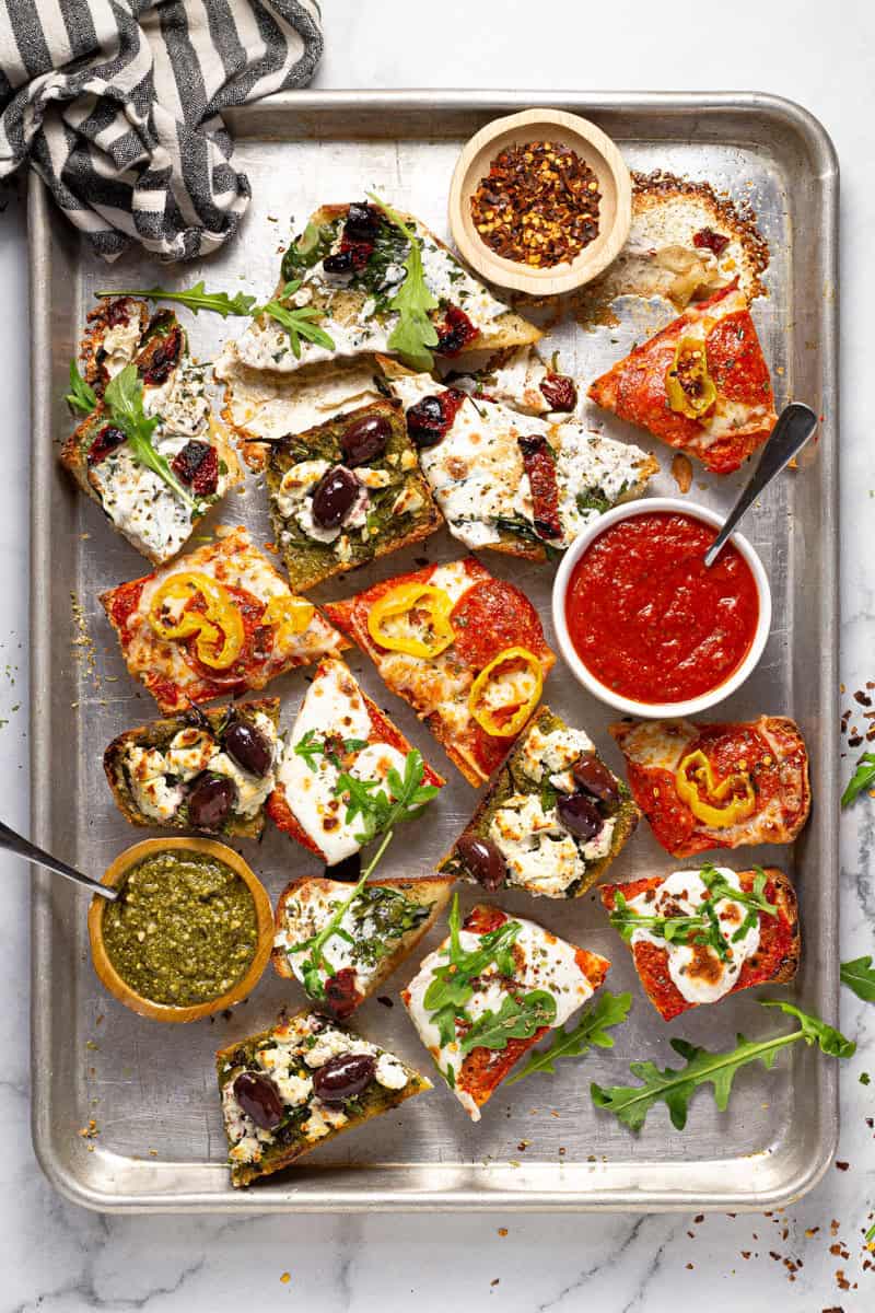 Baking sheet with freshly baked slices of French bread pizza