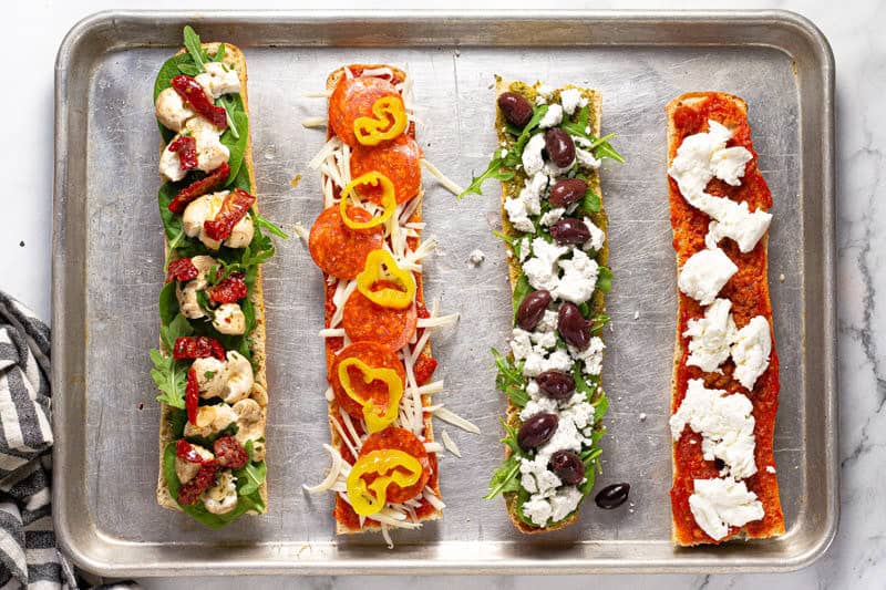 French bread pizza topped with sauce cheese and veggies