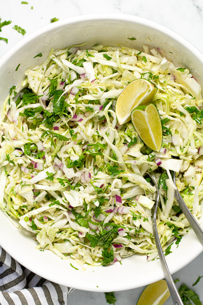 White bowl filled with homemade cilantro lime slaw