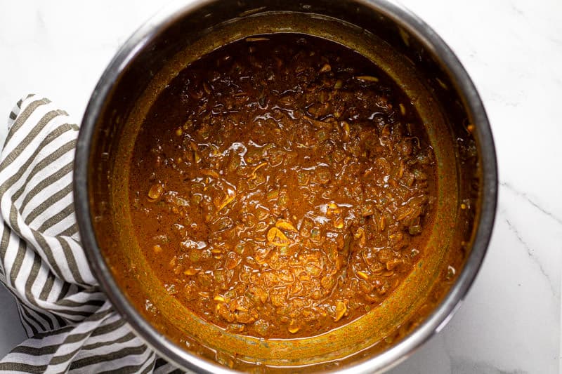 Instant pot insert with sauteed onions and spices in it
