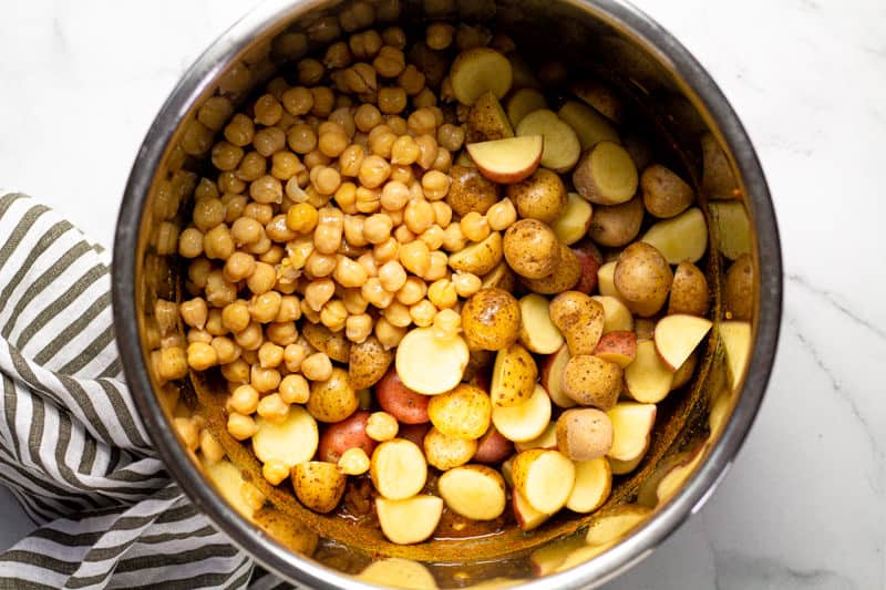 Instant pot insert with chickpeas and potatoes in it