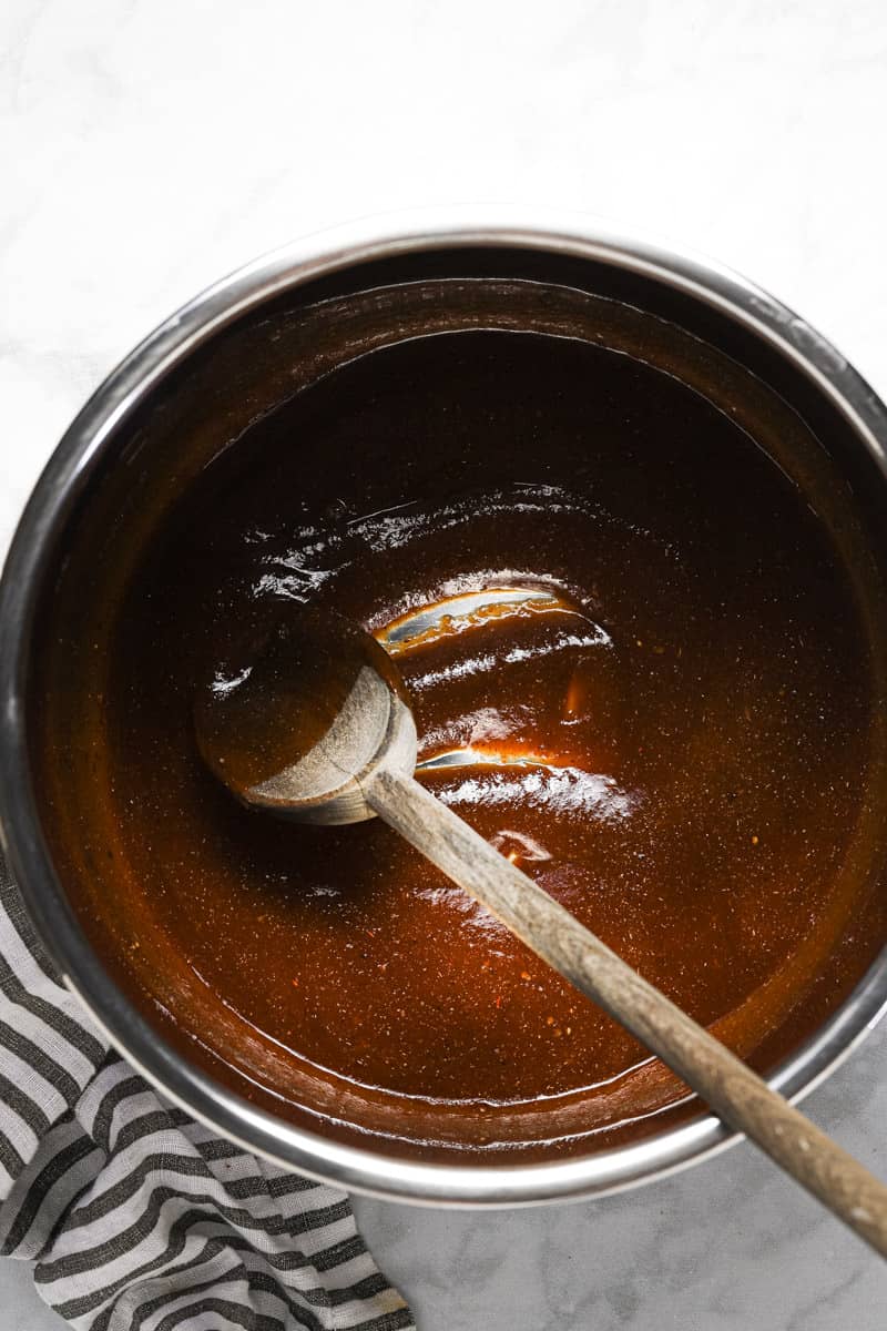 Instant pot insert with BBQ sauce and spices mixed together