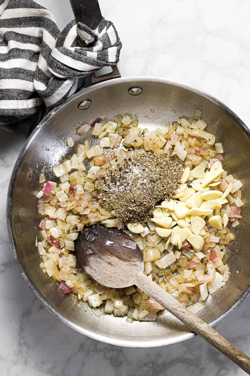Large sauté pan onion garlic and dried herbs in it
