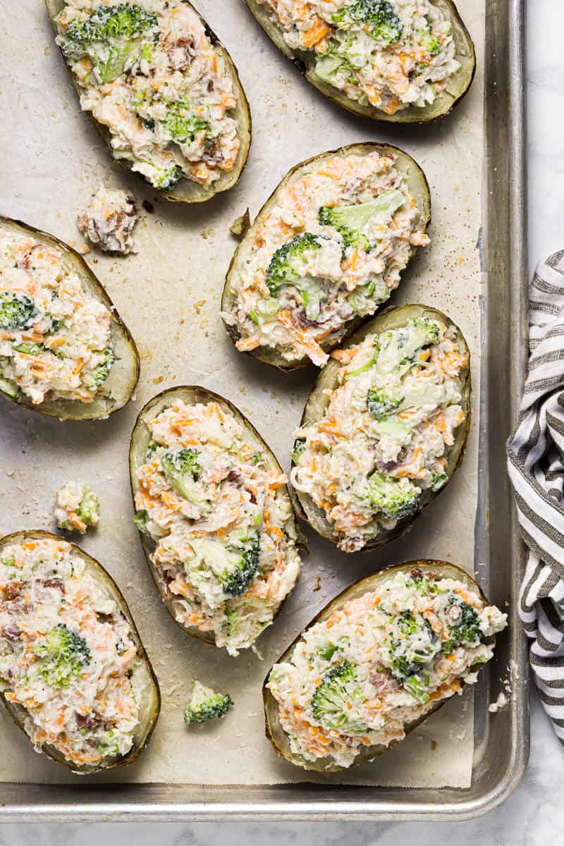 Baking sheet with twice baked potatoes ready to be baked in the oven